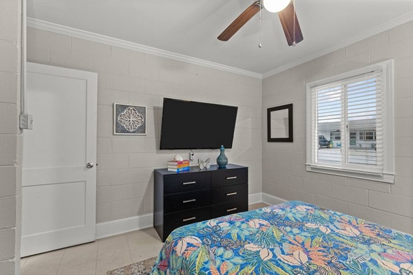 Your peaceful bedroom retreat features comfortable sleeping space with entertainment and storage at your fingertips.