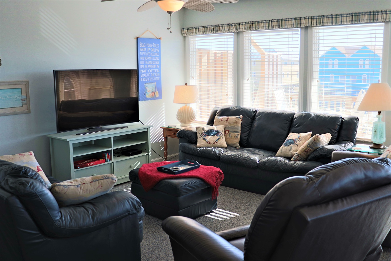 Sink into plush leather seating while enjoying your favorite shows on the large TV in this cozy living room retreat.