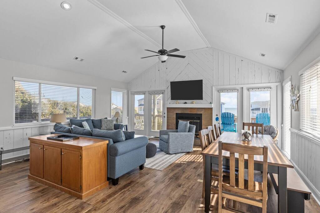 Relax in your bright, airy living space with soaring ceilings, cozy fireplace, and stunning views through picture windows.