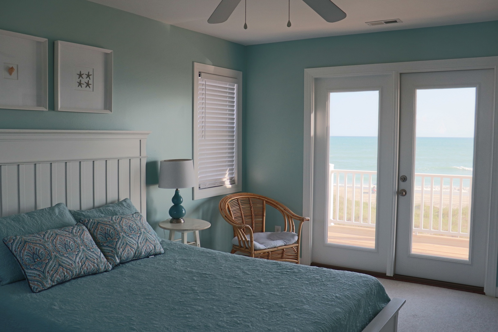 Wake up to stunning ocean views in this serene bedroom where soothing coastal colors and gentle sea breezes create your perfect retreat.