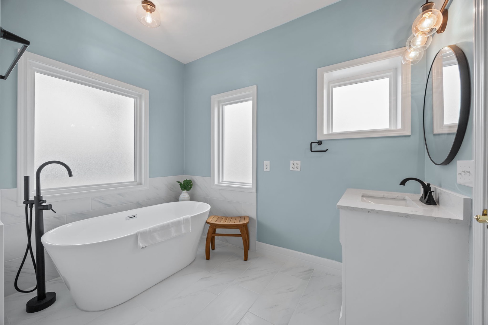 Unwind in your serene spa-like retreat with a luxurious soaking tub and elegant finishes designed for ultimate relaxation.