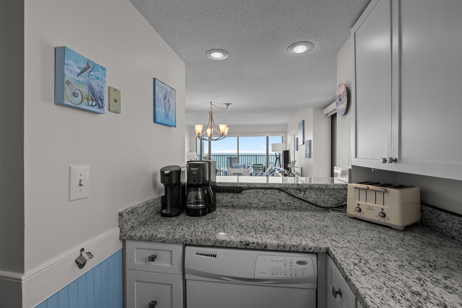 Your oceanfront kitchen features granite counters, modern appliances, and stunning sea views while you brew morning coffee.