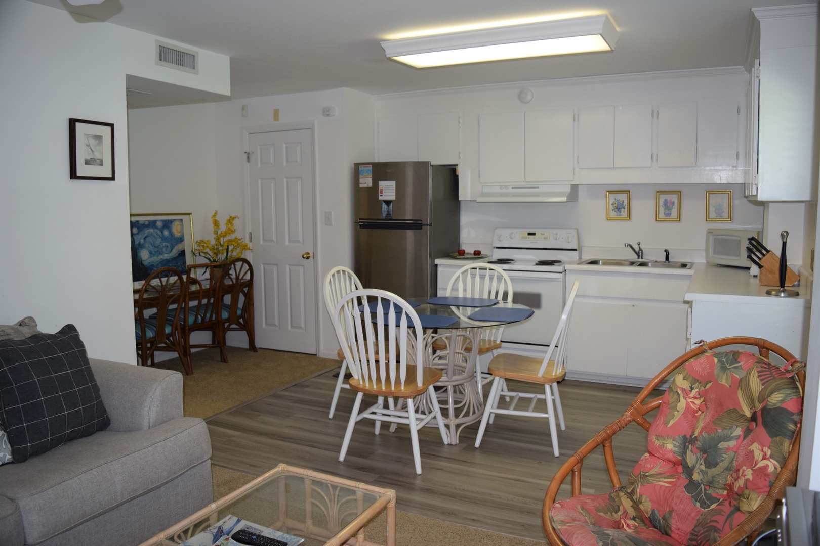 Your bright, open-concept space seamlessly blends kitchen and living areas, perfect for cooking together and relaxing after beach days.