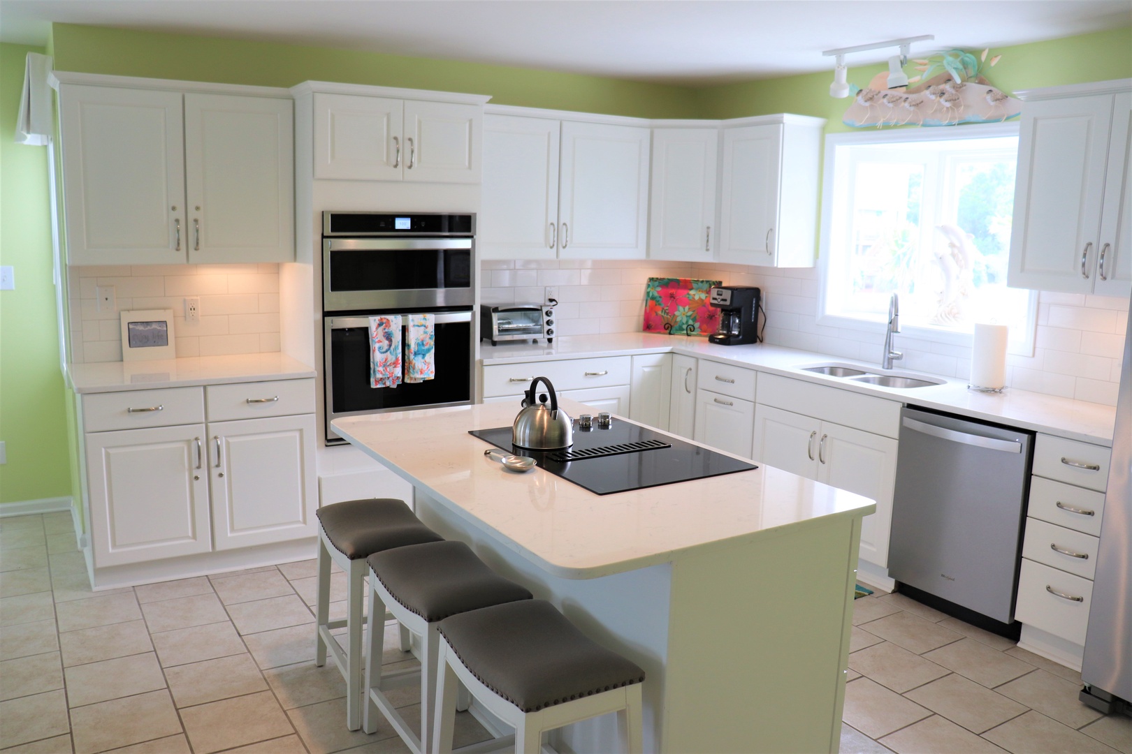 Your spacious kitchen features modern appliances, granite countertops, and breakfast bar seating where you can enjoy morning coffee or casual meals together.