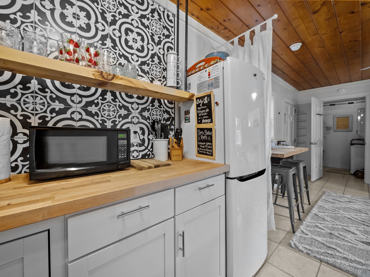 Your modern kitchen features stylish geometric tile, warm wood counters, and everything needed for memorable meals together.