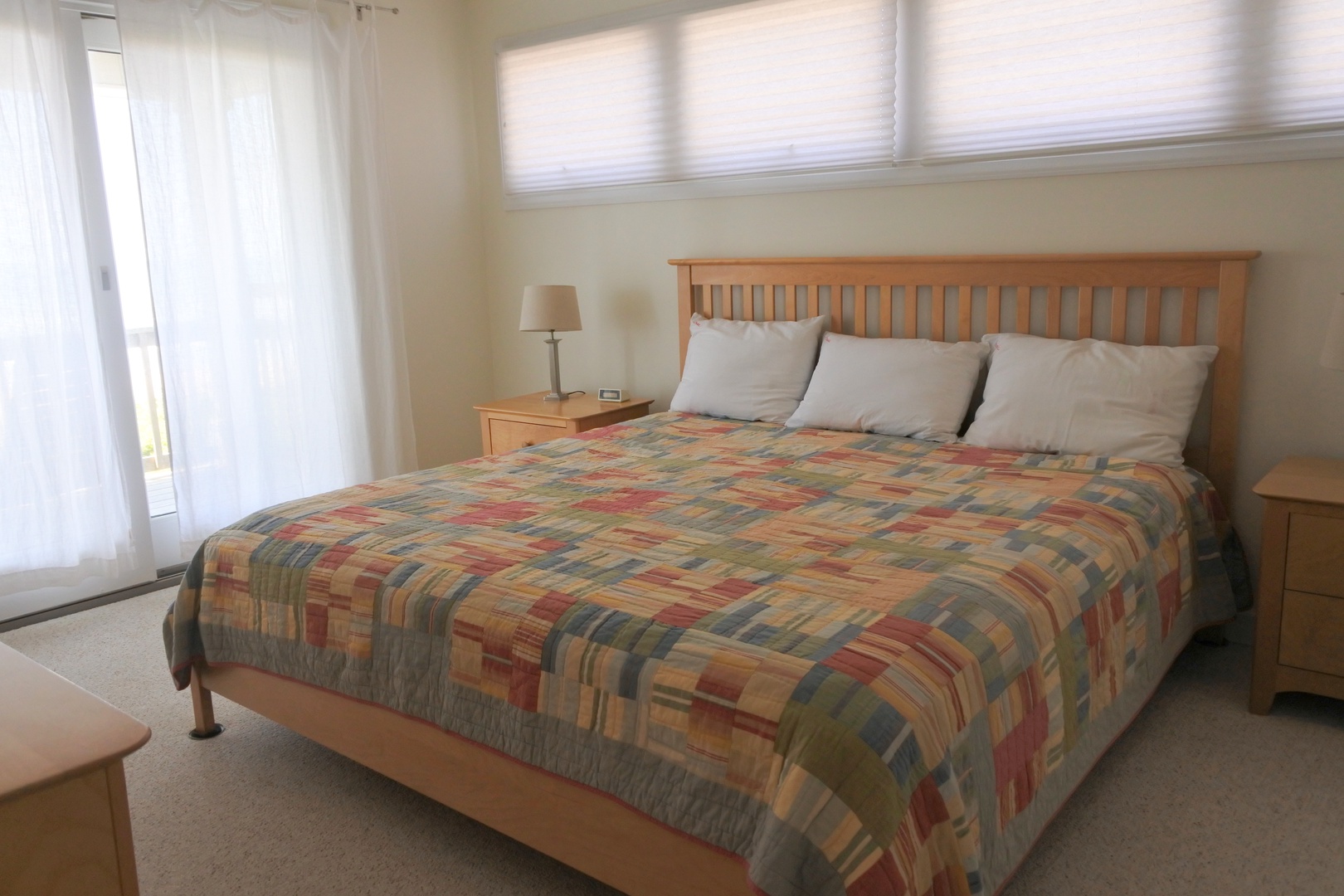 Sink into your comfortable bed with soft natural light filtering through windows, creating a peaceful retreat for restful nights.