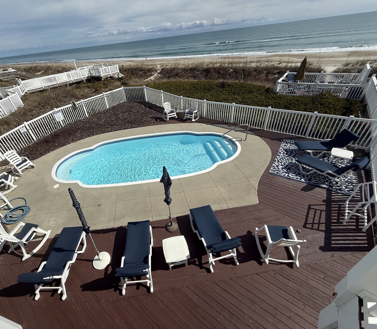 Unwind beside your private pool with pristine ocean views stretching to the horizon, perfect for morning swims and beachside relaxation.