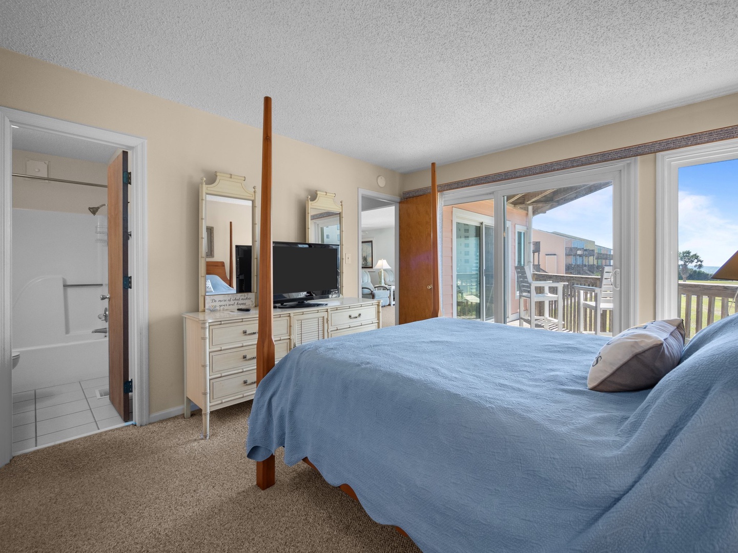 Wake up to serene morals in your master suite, where soft blue linens and private balcony access create your peaceful retreat.