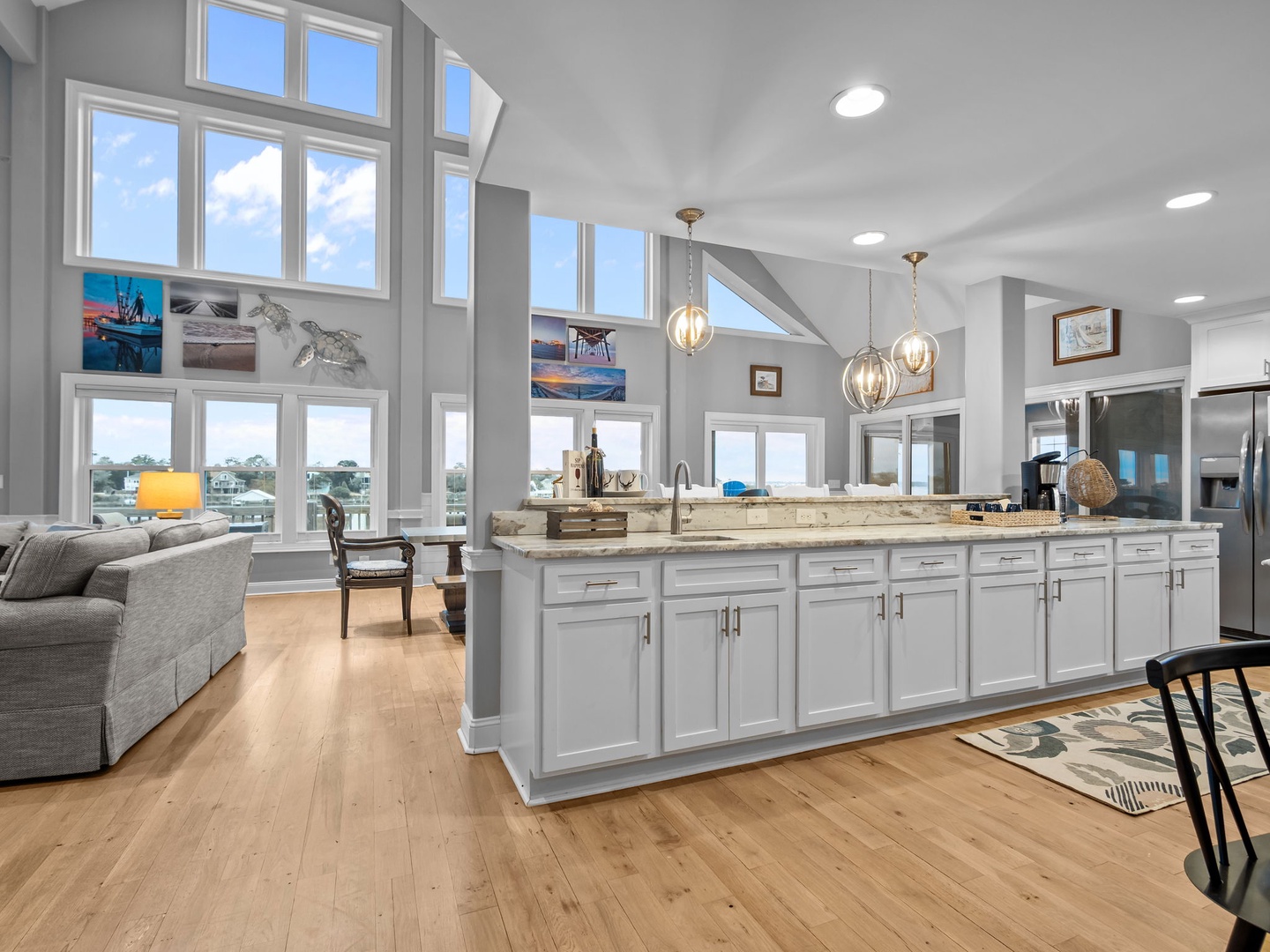 Cook and entertain in your stunning open-concept kitchen, where soaring ceilings and expansive windows frame breathtaking views while you create memorable meals.