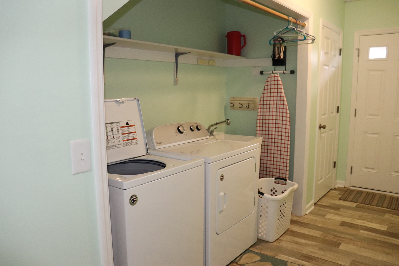 Your dedicated laundry nook keeps your stay stress-free with full-size washer and dryer, plus handy storage and ironing board.