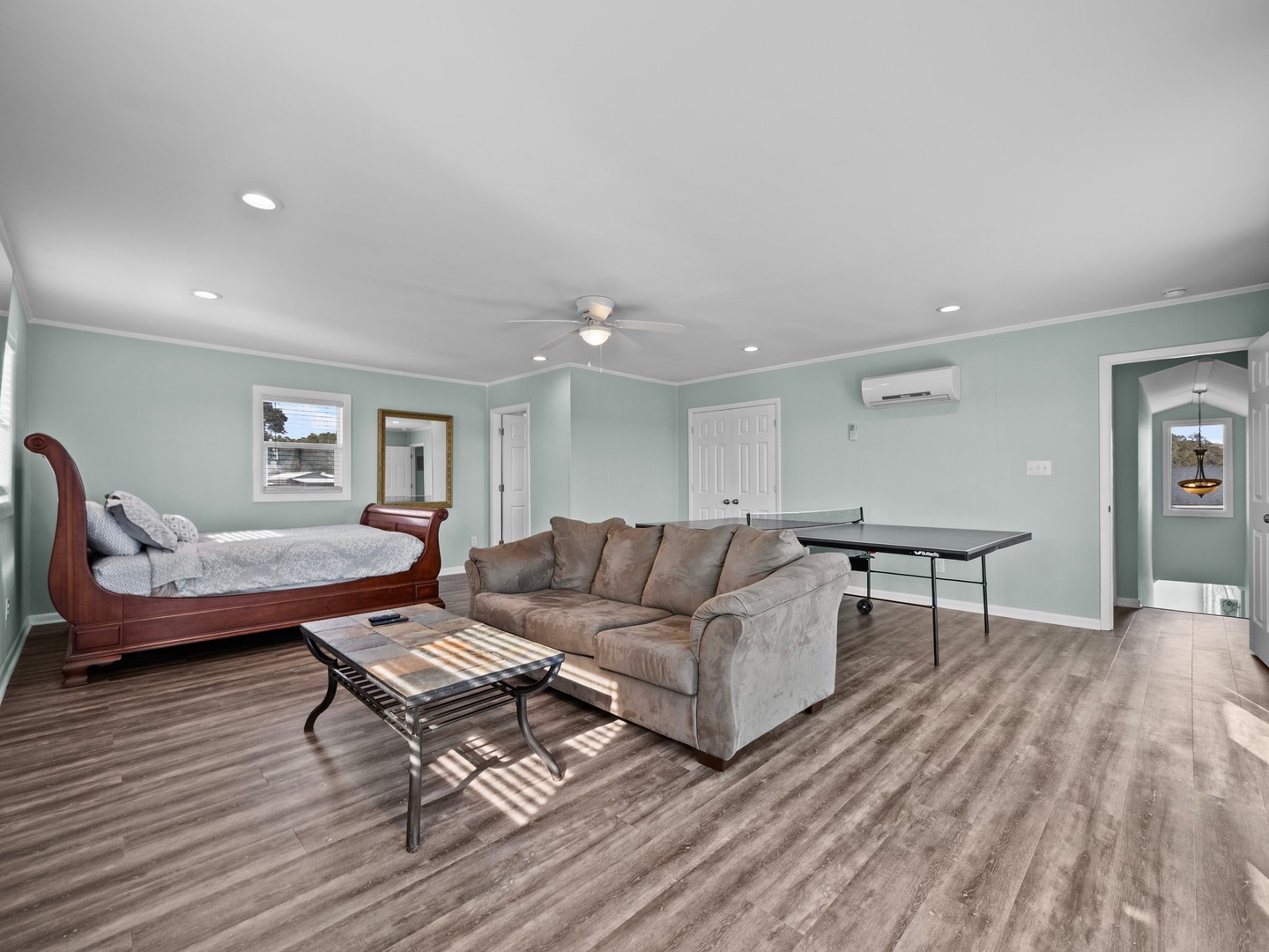 Relax in your spacious suite with plush seating, elegant bed, and modern amenities—complete with air conditioning and table tennis for entertainment.