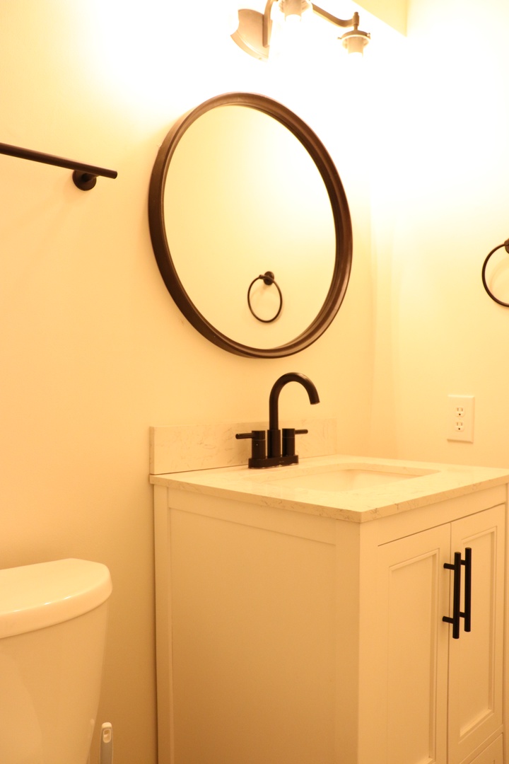 Your private bathroom features a sleek vessel sink and modern fixtures, creating a spa-like retreat for refreshing moments.