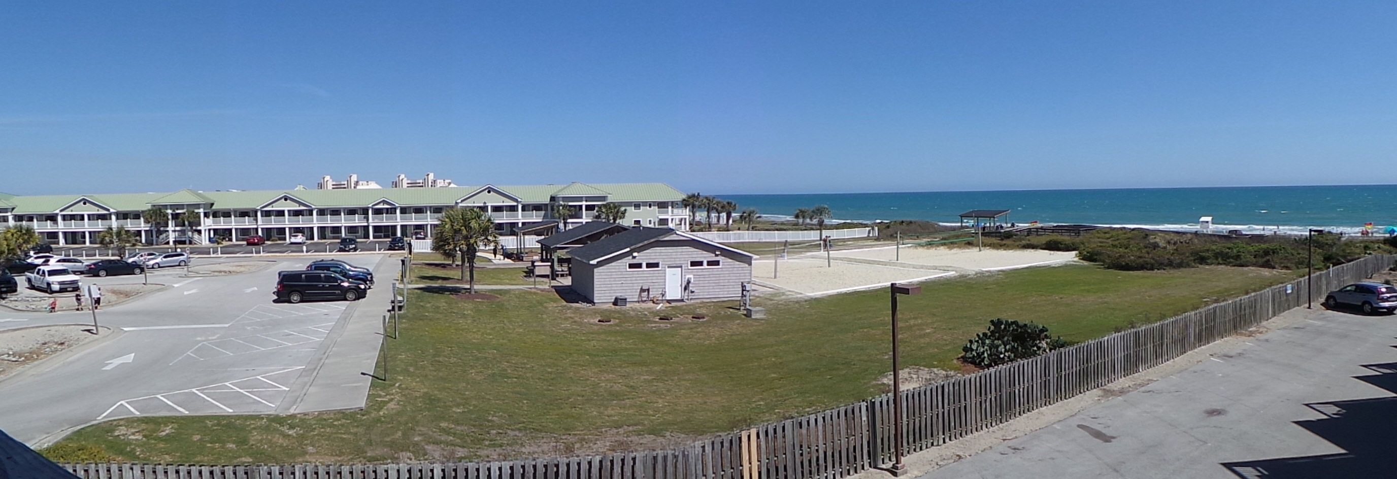 Beachfront property with pristine turquoise waters and white sand beach just steps away from the accommodations.