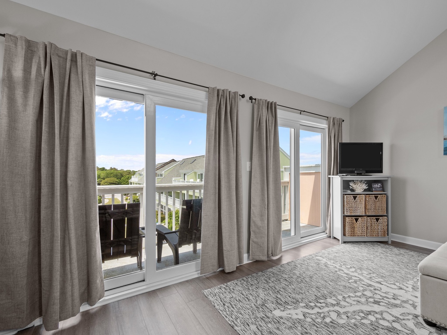 Relax in your bright living space with large sliding doors opening to your private balcony and comfortable seating.