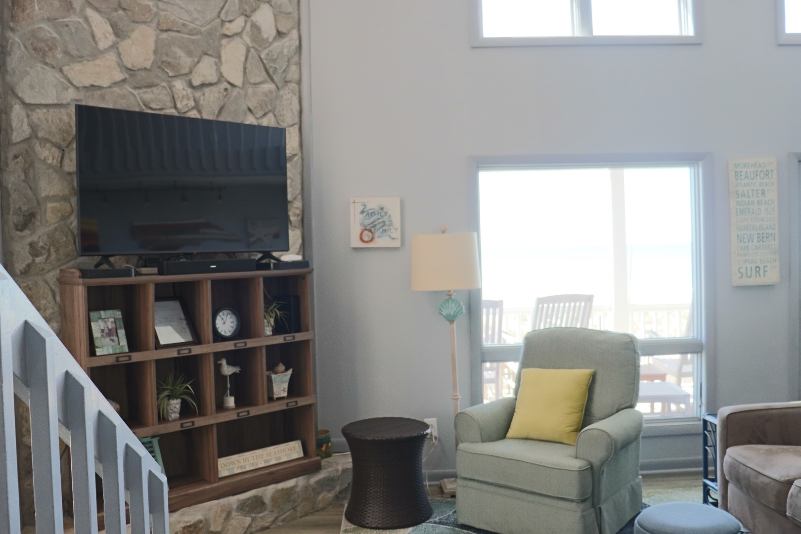 Unwind in your bright living space with stone fireplace and cozy seating, perfect for quiet moments.