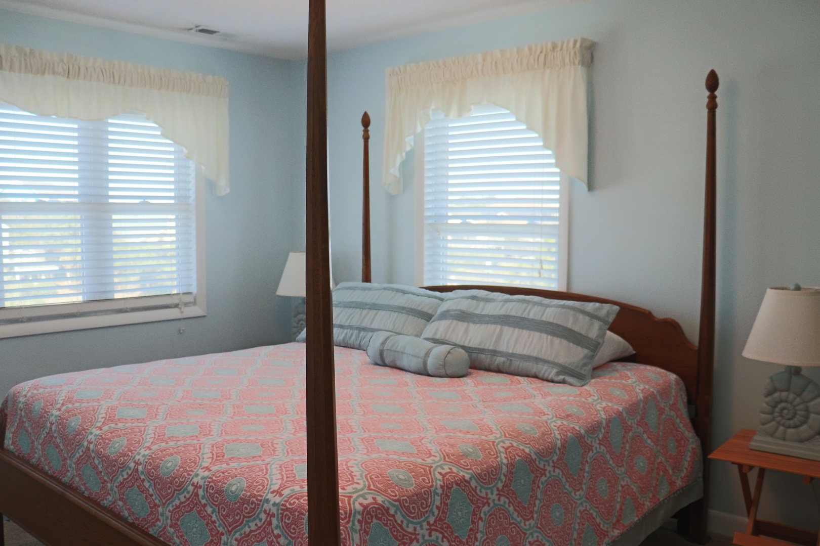 Drift into peaceful sleep in your elegant four-poster bed, where soft linens and gentle morning light create the perfect retreat.