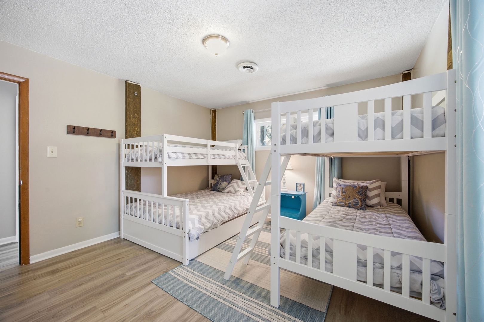 Your kids will love this cheerful bunk room with cozy beds and plenty of space to play and rest after beach adventures.