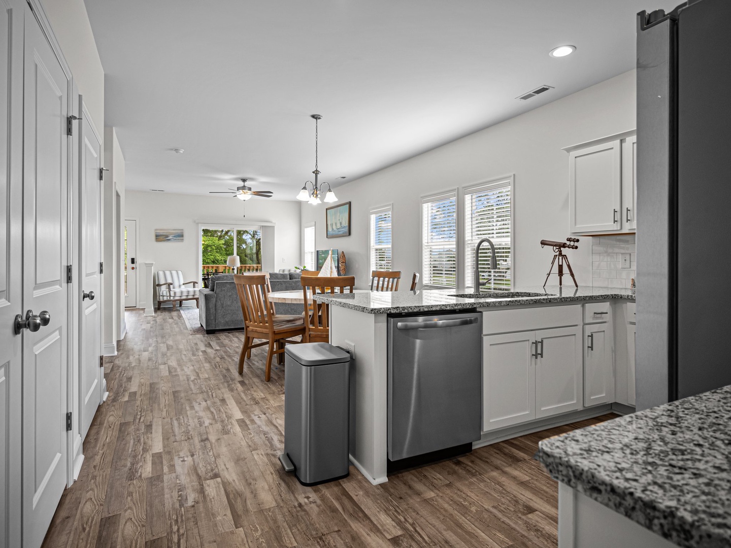 Enjoy cooking in your spacious kitchen with granite counters, stainless appliances, and open sightlines to the dining and living areas.