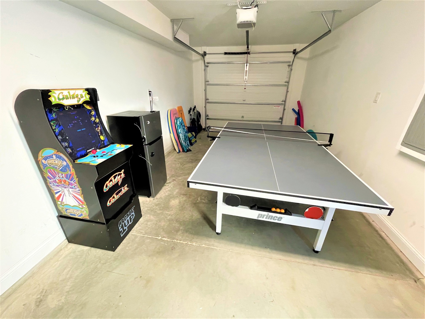 Your private game room awaits with classic arcade fun and ping pong battles in this spacious garage retreat.