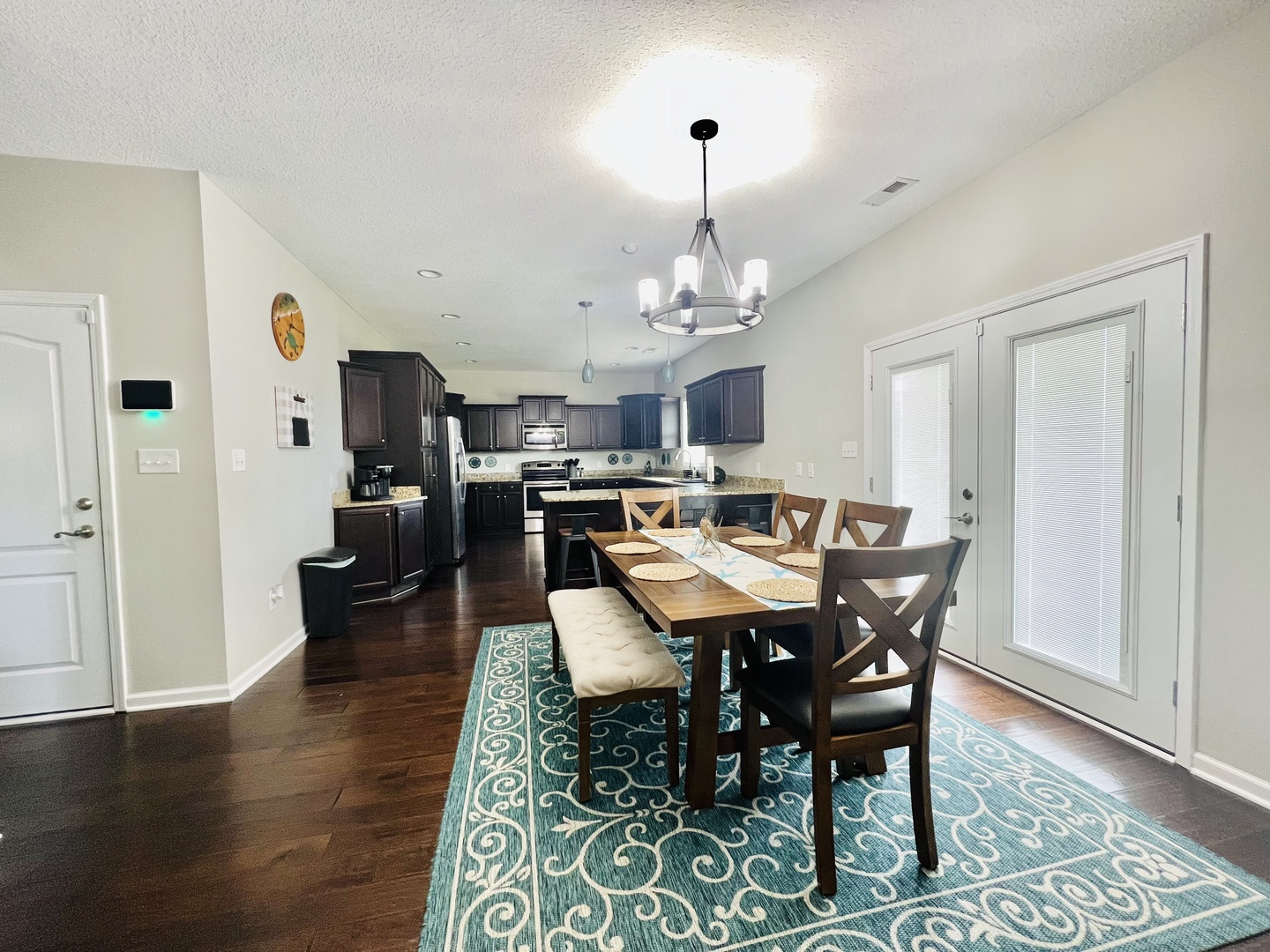Your open-concept kitchen and dining space invites family gatherings, featuring modern appliances and a welcoming table for memorable meals together.