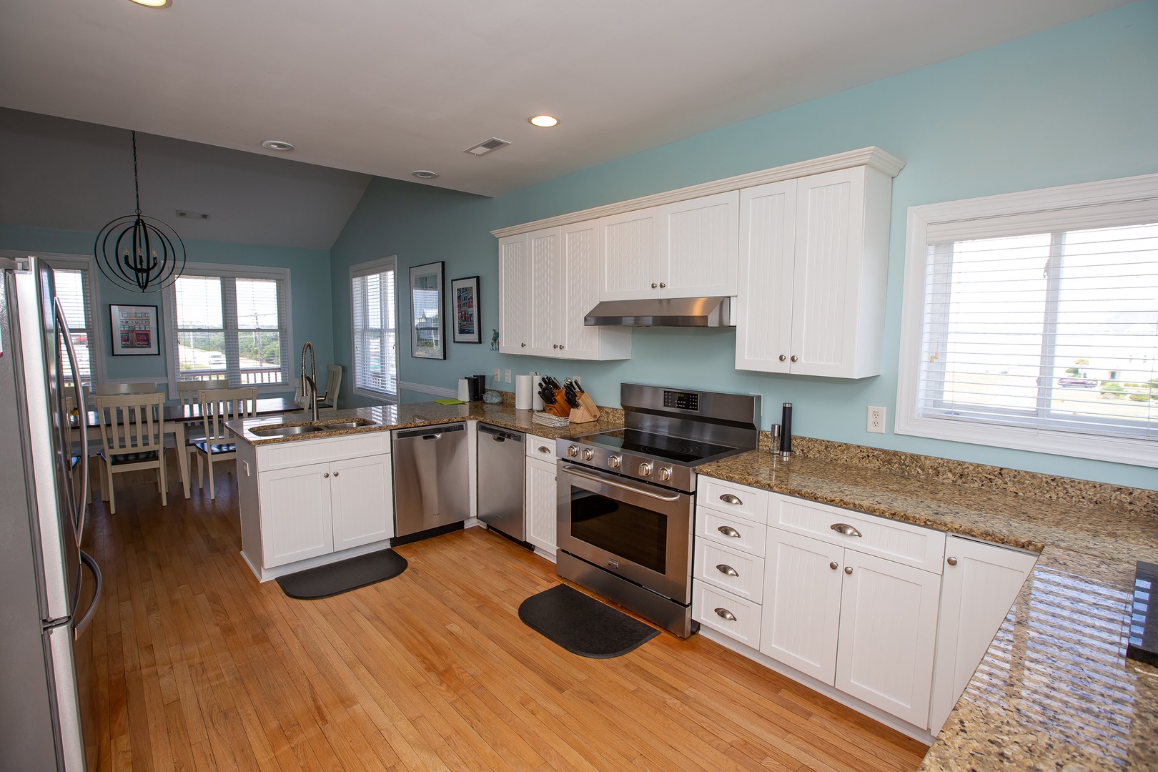 Step into your fully equipped kitchen with granite counters, stainless appliances, and soothing coastal colors—perfect for creating memorable meals together.