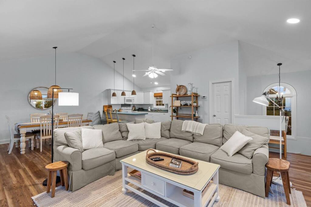 Sink into your spacious sectional sofa while meals simmer in the open kitchen—this inviting great room becomes your gathering hub.