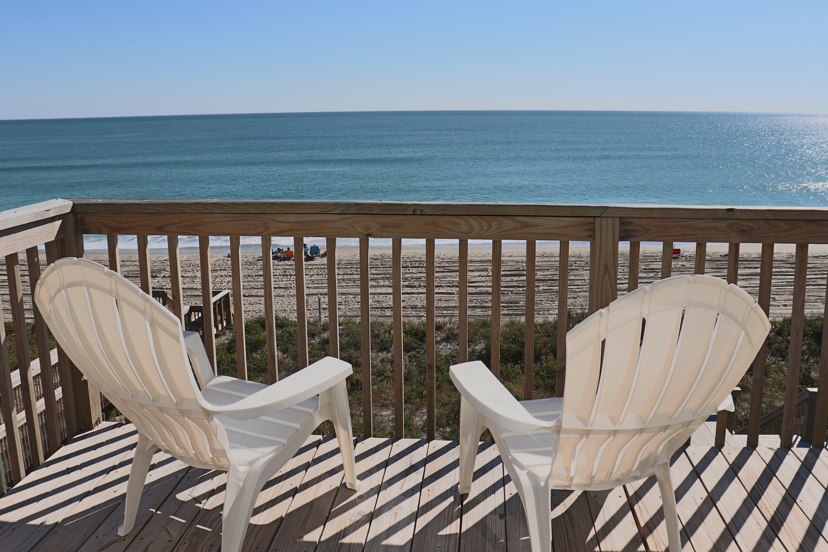Unwind in these comfortable chairs while enjoying direct beachfront views from your private deck.