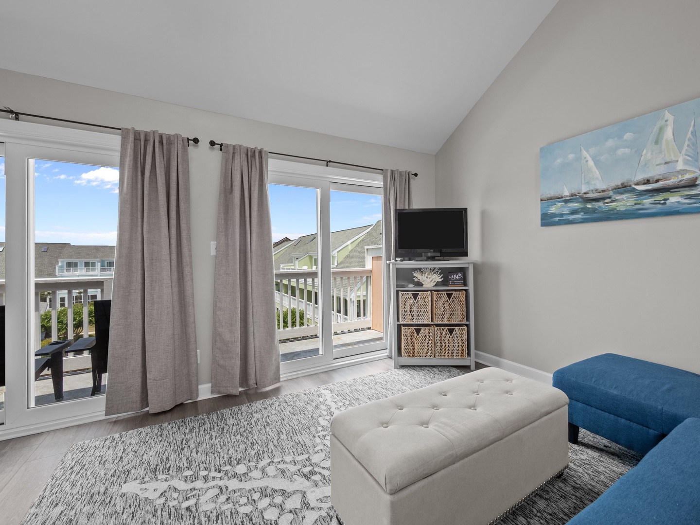 Relax in your bright coastal living space with comfortable seating and sliding doors opening to your private balcony.