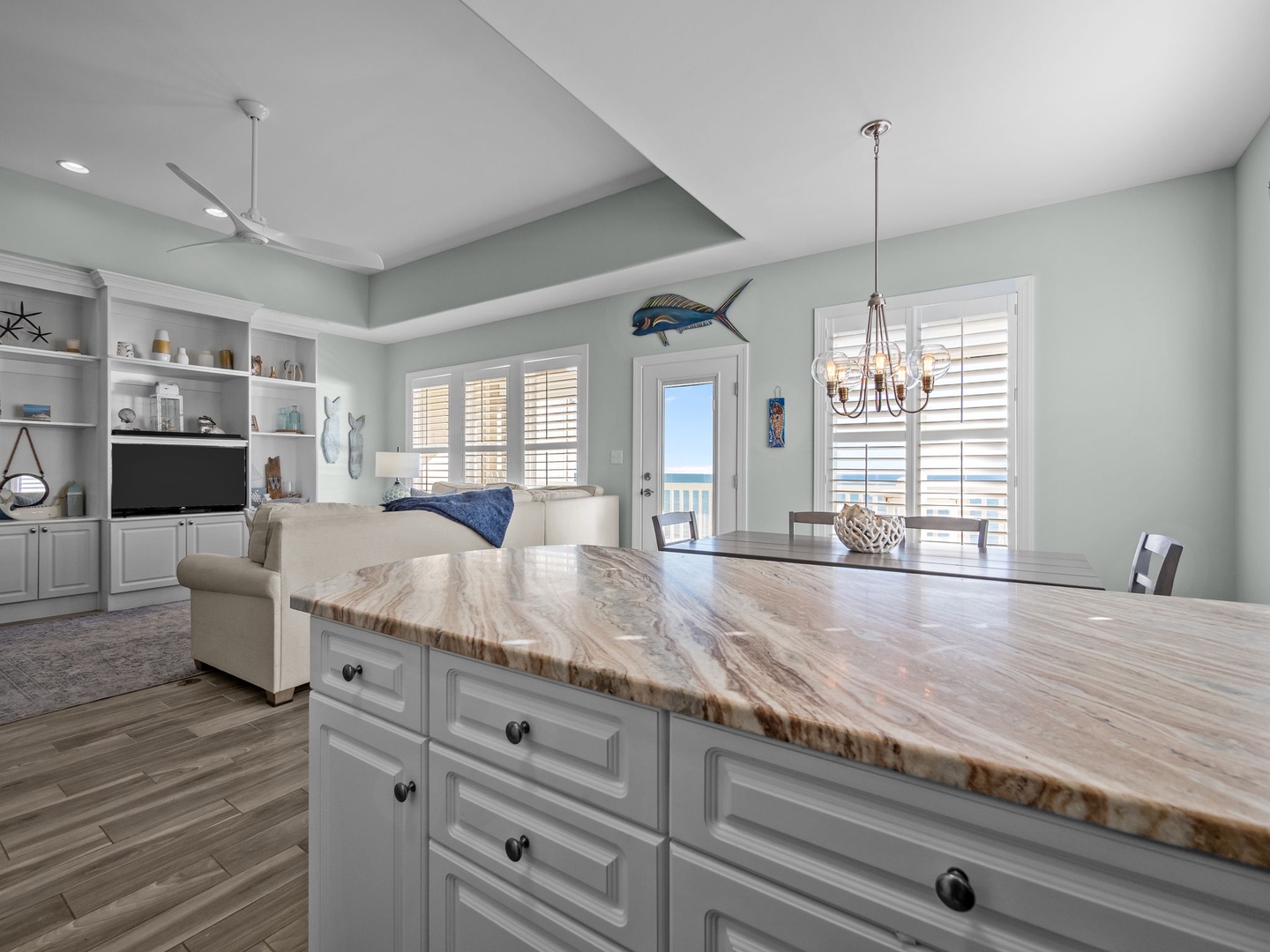 Gather around this stunning granite island while you cook and connect, with ocean breezes flowing through and coastal views just steps away.