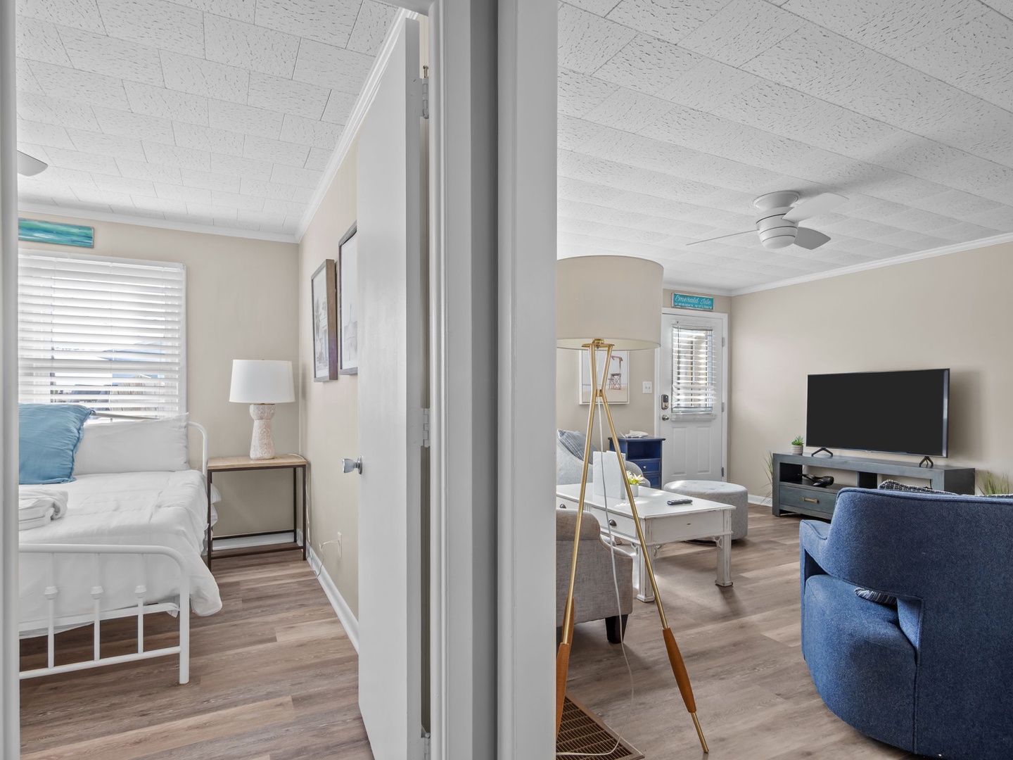 Your bright coastal retreat features an open layout connecting bedroom to living space, perfect for relaxing after beach days.