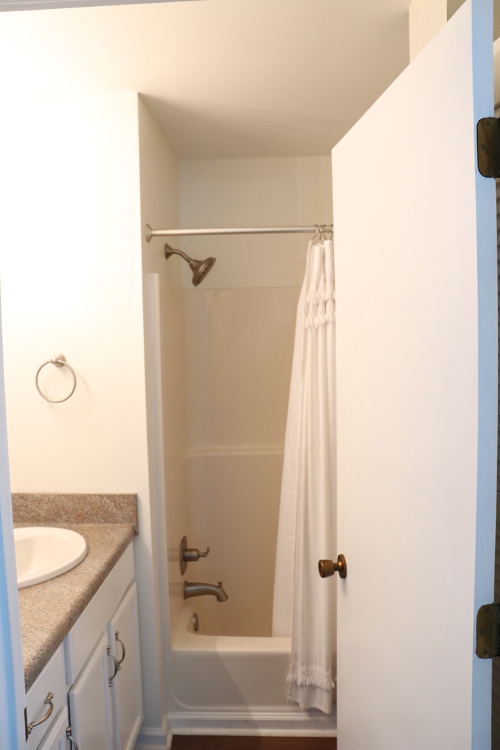 Unwind in your private bathtub where warm water and soft towels await your perfect relaxation moment.