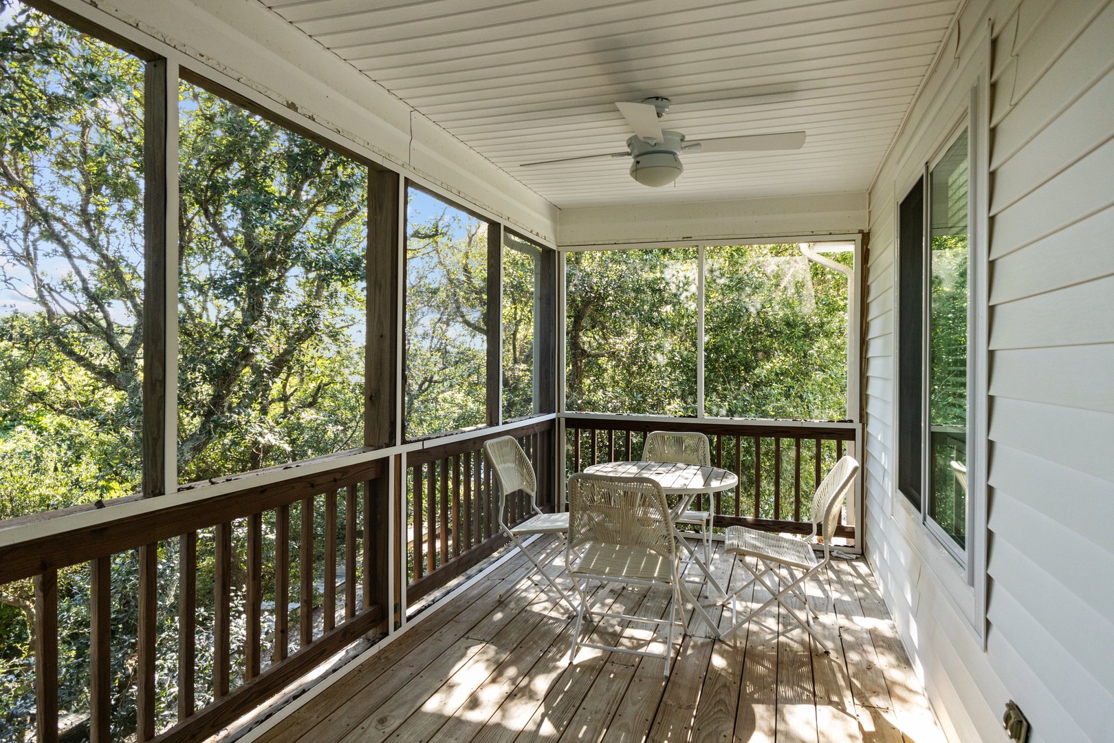 Relax on your private screened porch with treetop views, where morning coffee tastes better surrounded by nature's peaceful canopy.