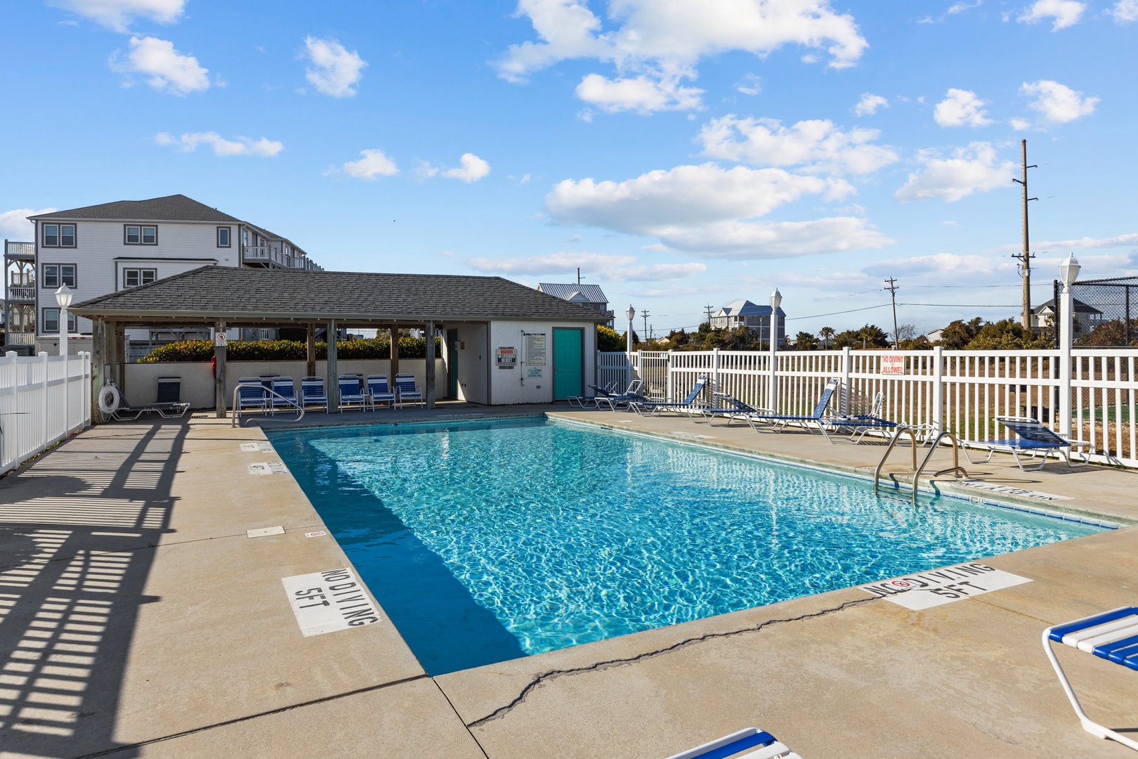 Dive into relaxation at this sparkling community pool, perfectly positioned with comfortable lounge chairs for your sunny afternoon escapes.