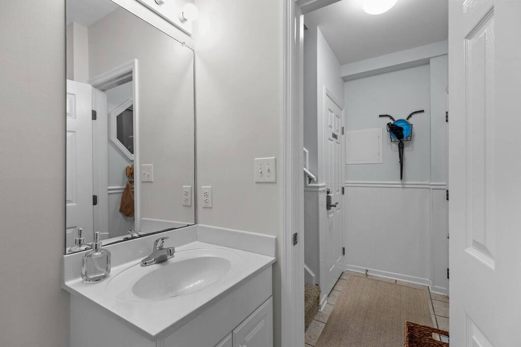 Fresh white bathroom with modern vanity and walk-in shower - your clean, bright retreat awaits.