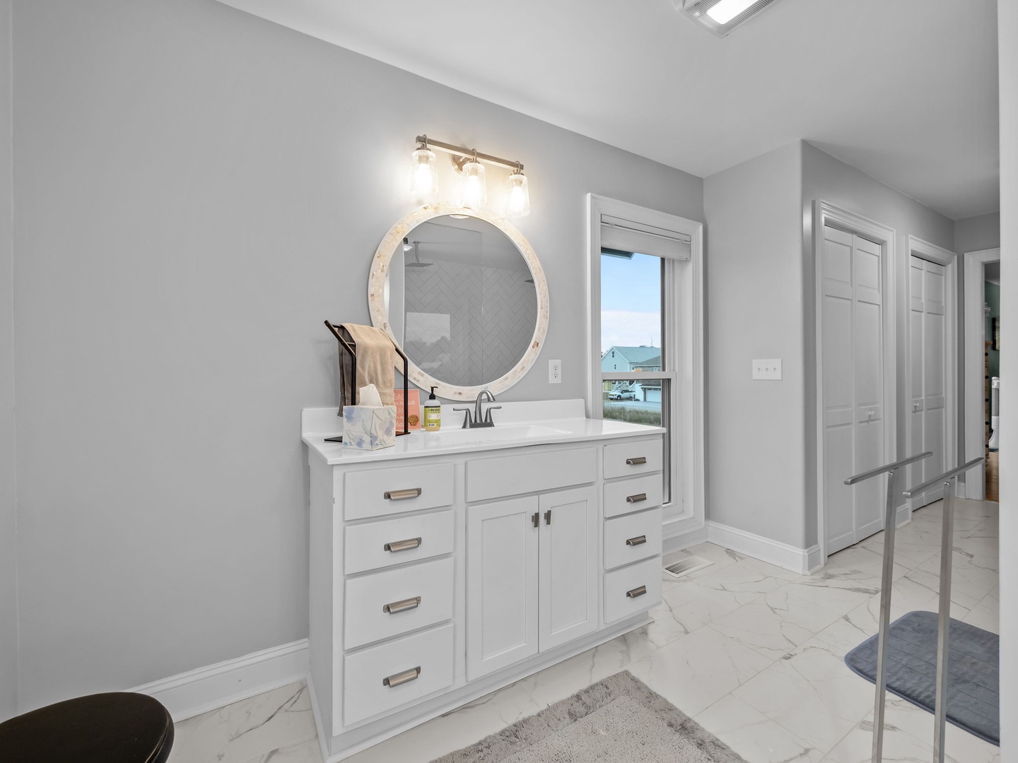 Your stylish bathroom features elegant finishes and a sleek design, perfect for your morning routine with plenty of storage space.
