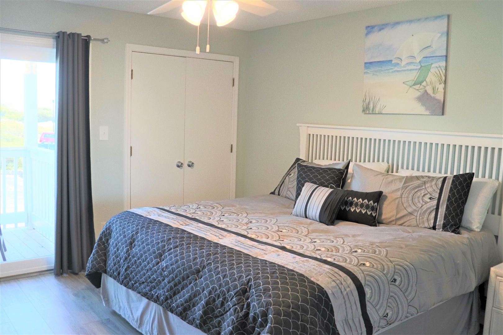 Drift off in your coastal sanctuary, where ocean artwork and soft linens create the perfect retreat after beach adventures.