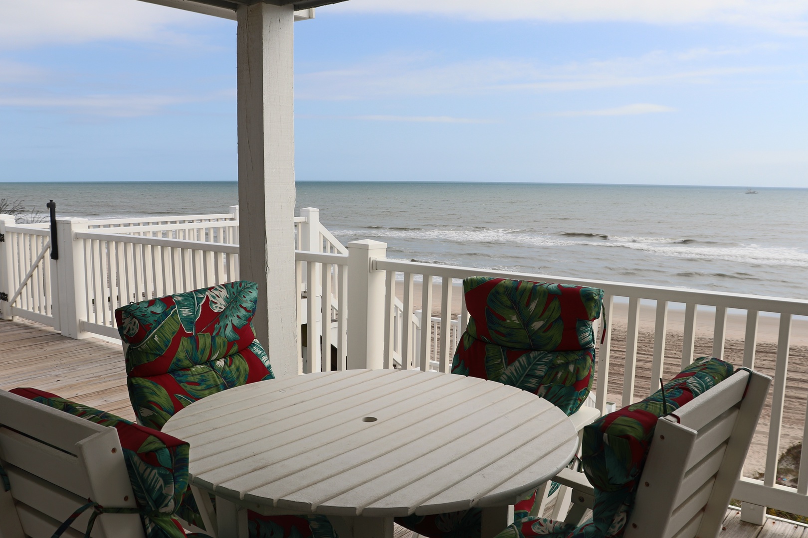 Savor your morning coffee on your private deck with unobstructed ocean views and gentle waves just steps away.