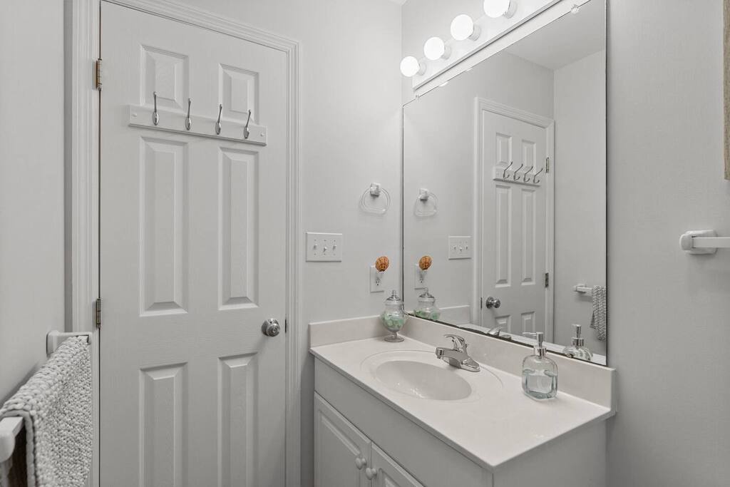 Freshen up in your private bathroom with pristine fixtures, ample counter space, and thoughtful touches like luxurious hand soap dispensers.