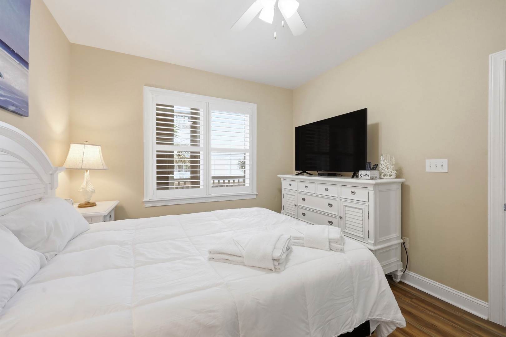 Sink into plush bedding and unwind in your own peaceful retreat, complete with a flat-screen TV and airy coastal charm.
