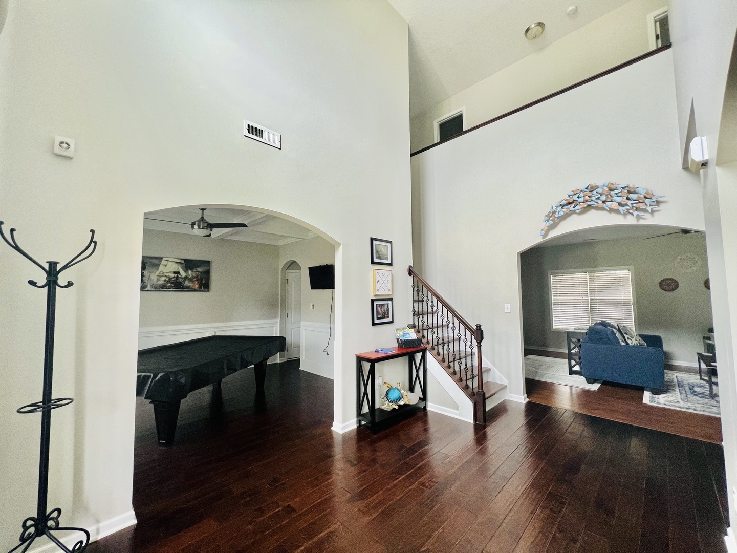 Step into your spacious retreat with soaring ceilings, rich hardwood floors, and elegant archways connecting living spaces for memorable gatherings.