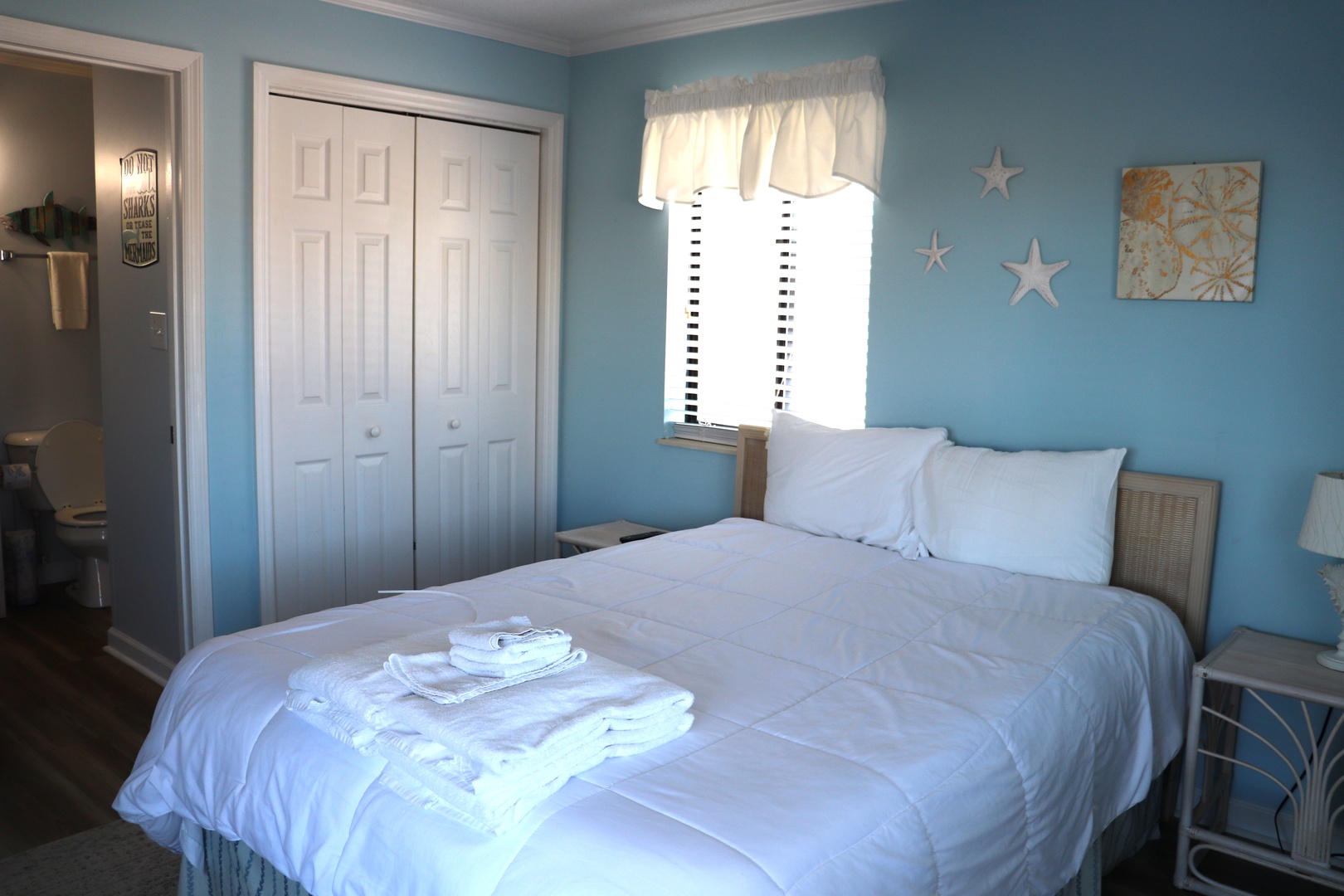 Drift into peaceful dreams in your ocean-blue bedroom, where crisp linens and coastal decor create the perfect seaside retreat.