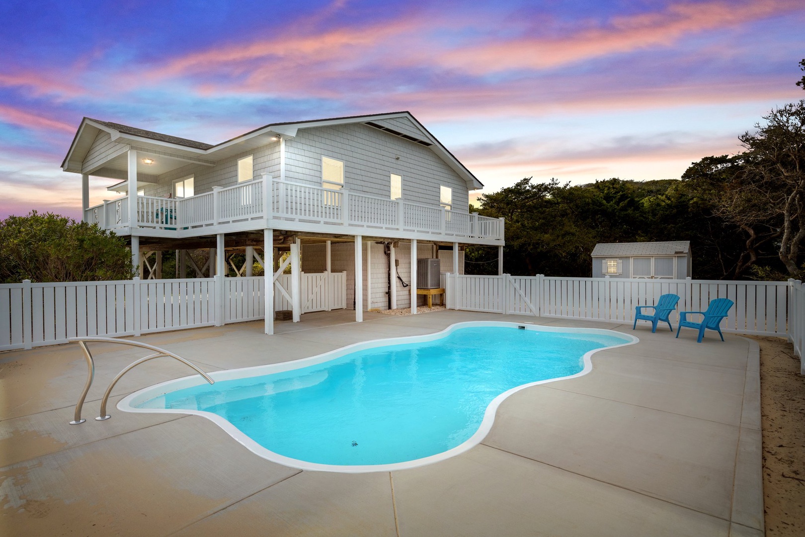 Coastal retreat with private pool and stunning sunset views over the property's peaceful setting.