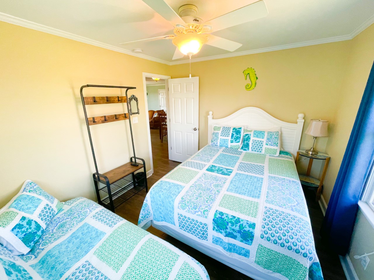 Rest peacefully in your coastal-themed bedroom where ocean blues and greens create a soothing sanctuary for your getaway.