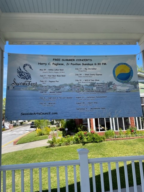 A community event board displays local summer concerts and activities, giving you insight into the vibrant neighborhood culture.