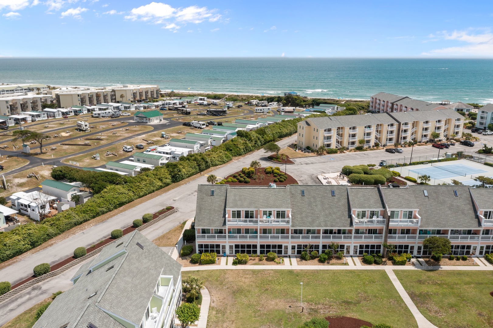 Beachfront property nestled between ocean waves and coastal community, offering prime location near sandy shores and local amenities.