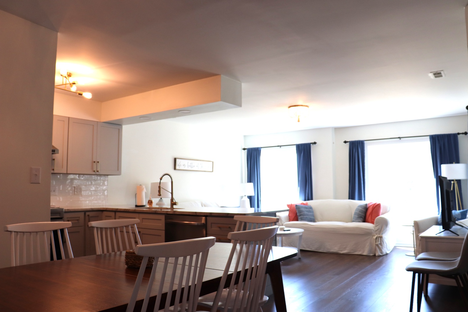 Relax in your bright open-plan living space where kitchen, dining, and lounge flow seamlessly together for memorable vacation moments.