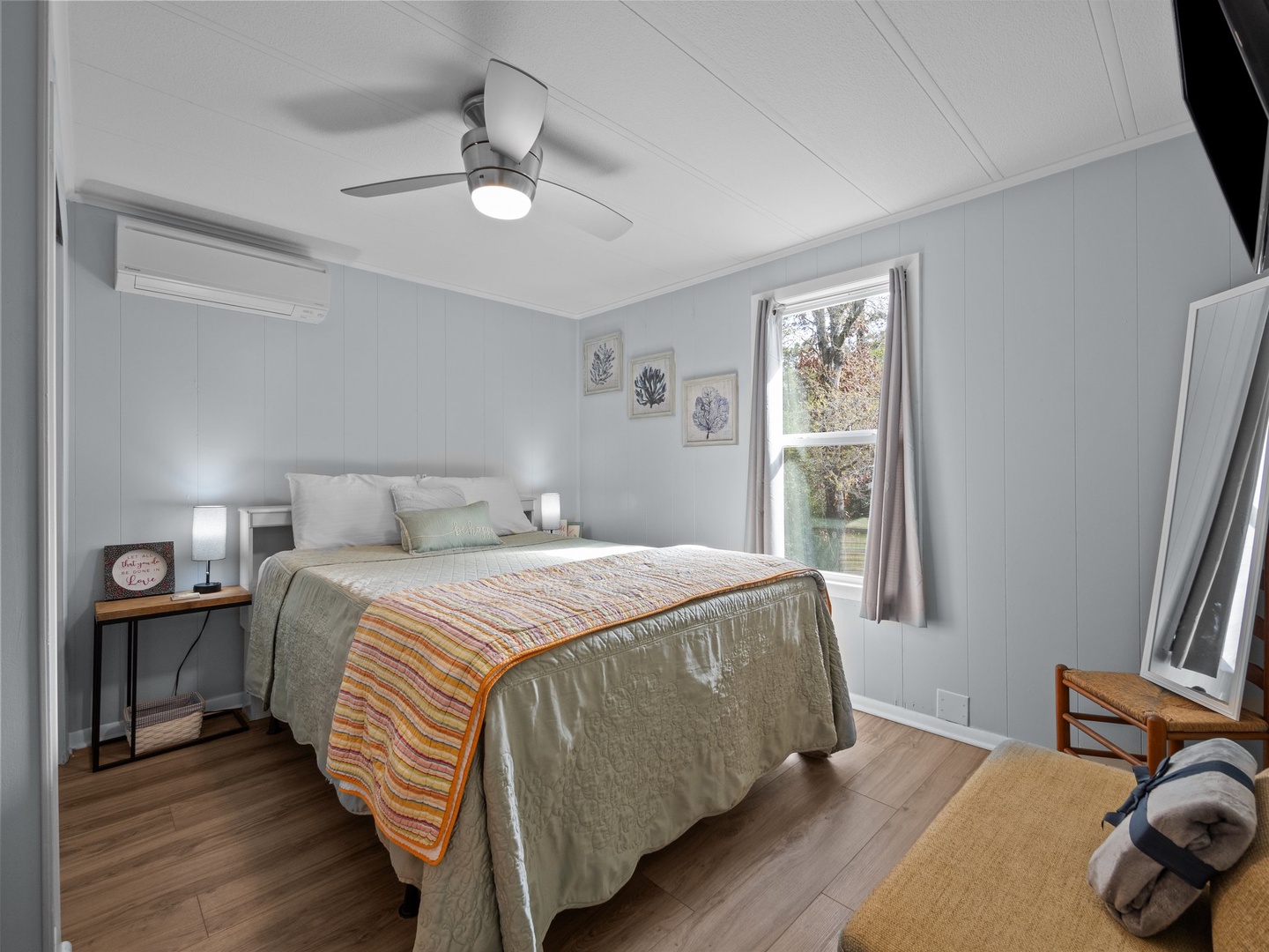 Your peaceful bedroom features a comfortable bed with crisp linens, modern air conditioning, and a ceiling fan to keep you cool and comfortable year-round.