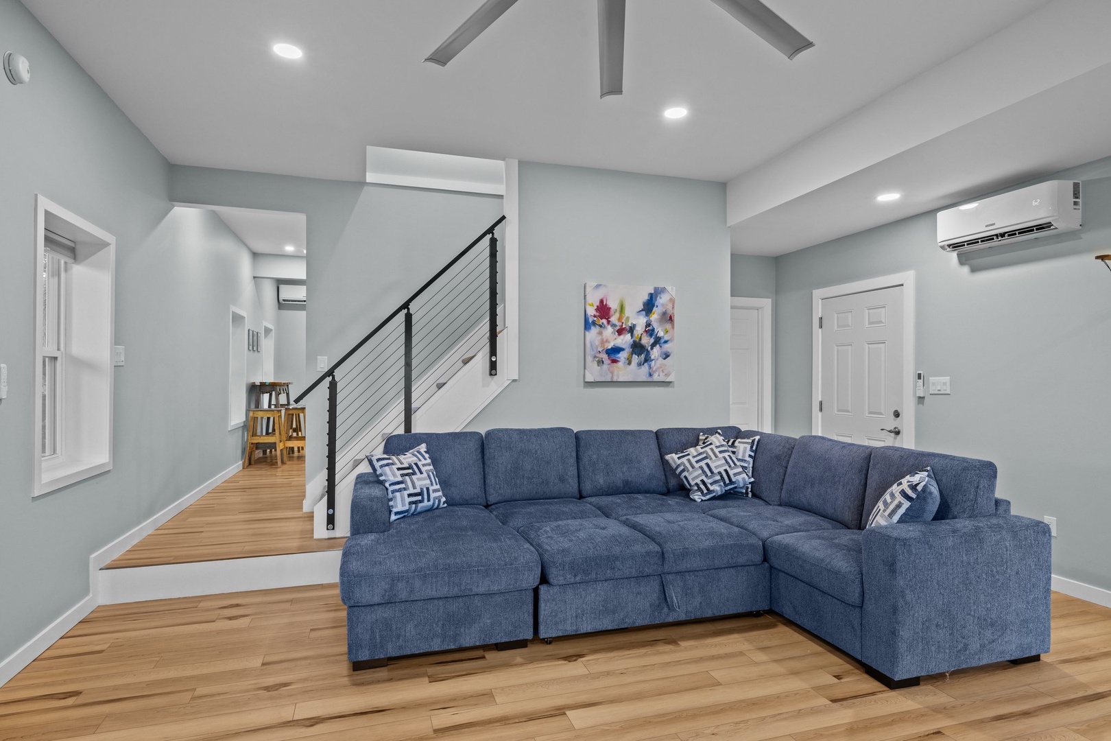 Your spacious living area features a plush sectional sofa perfect for relaxing after exploring the city.