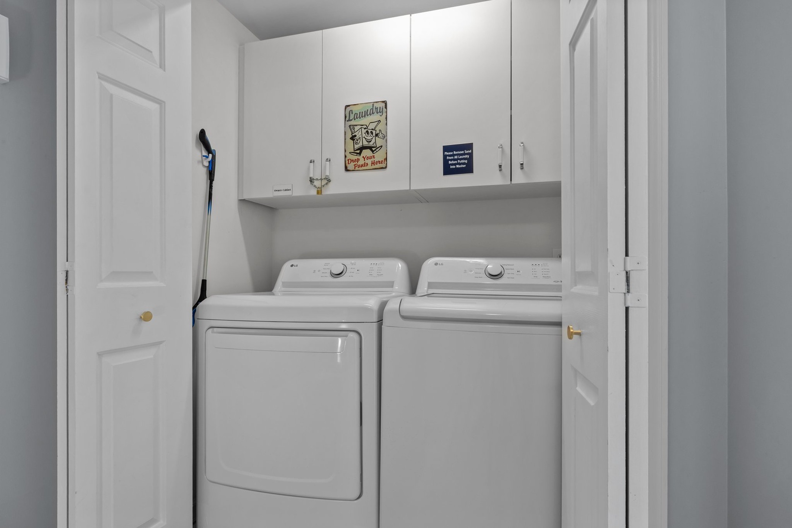 Your own in-unit laundry room keeps you fresh throughout your stay, with full-size washer and dryer tucked into clean white cabinetry.