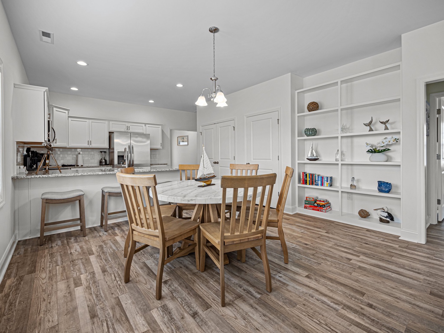 Your open-concept kitchen and dining space features granite counters, stainless appliances, and cozy seating for memorable meals together.